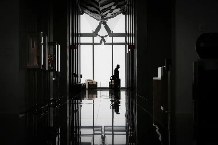 A worker waits for the elevator in the 60th-floor lobby of Four Seasons Hotel in Philadelphia, Pa. on July 23, 2020. The hotel reopens on Monday, July 27, with new safety protocols for guests during the pandemic.