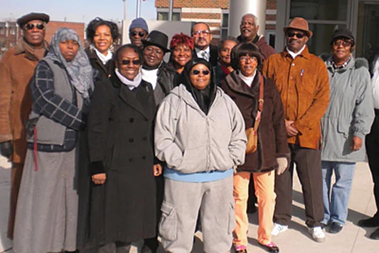 Members of the West Philadelphia Coalition of Neighborhoods and Businesses Community Advisory committee and other interested neighbors gather outside the city's new Juvenile Justice Services Center at 48th and Haverford.