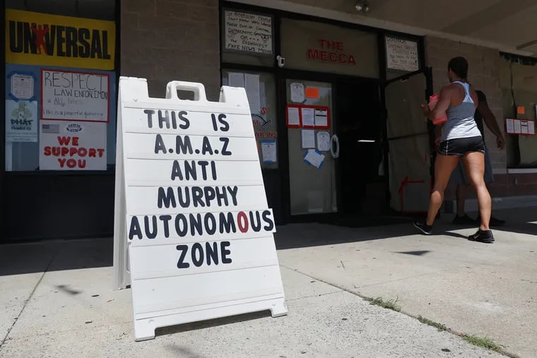 A member enters the Atilis Gym in Bellmawr, N.J., on Tuesday, July 21, 2020. The gym has reopened against New Jersey's coronavirus restrictions and is allowing up to 70 members inside at a time, but a judge denied Monday the state's request to hold its owners in contempt of court, instead ordering the gym to comply with tighter limitations on gym usage.