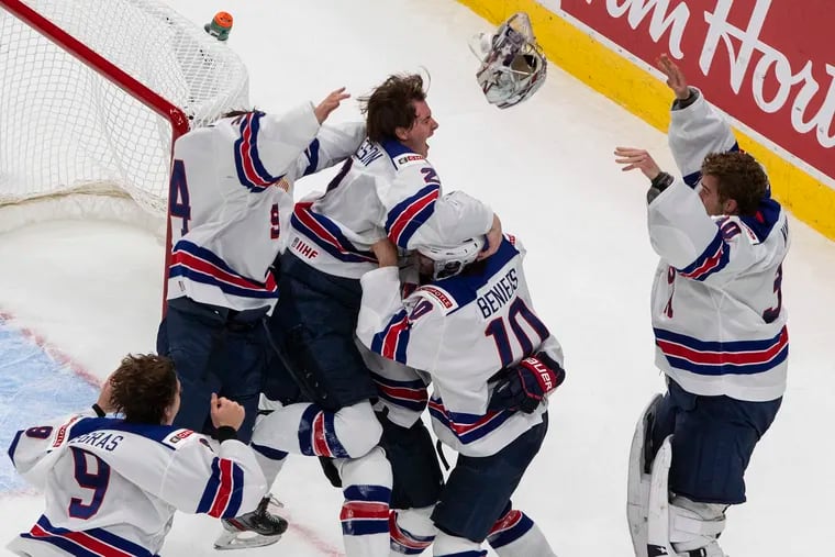 U.S. players celebrate a stunning 2-0 win Tuesday over Canada in the title game in the IIHF World Junior Hockey Championship in Edmonton.