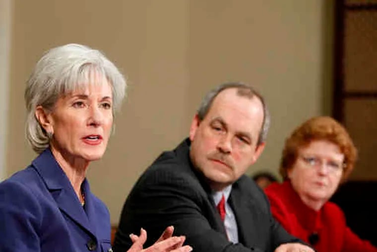 Pennsylvania Insurance Commissioner Joel Ario at a White House forum March 4 with Health and Human Services Secretary Kathleen Sebelius (left), insurance industry chiefs, and other state commissioners such as Jane Cline (right) of West Virginia.