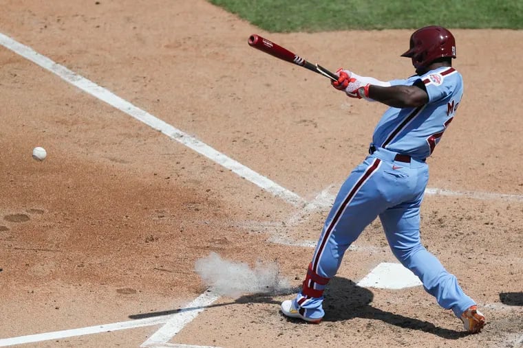 Phillies Andrew McCutchen hits into a third-inning fielder's choice to plate a run during Game 1 of the doubleheader against the Atlanta Braves on Sunday, August 9, 2020.