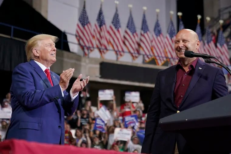 Former President Donald Trump (left) is joined on stage by Pennsylvania Republican gubernatorial candidate Doug Mastriano at a Sept. 3 rally in Wilkes-Barre, Pa.