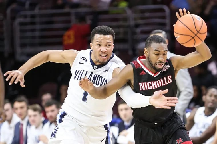 Villanova's Jalen Brunson tries to take the ball from Nicholls State's Lafayette Rutledge during the first half.