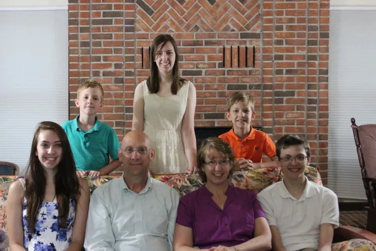 To celebrate her colon cancer remission, Celine Ryan and her husband Patrick posed with their children in July 2015. Seated from the left: Laurel, Patrick, Celine, Sean. Standing from left: Liam, Holly, Declan.
