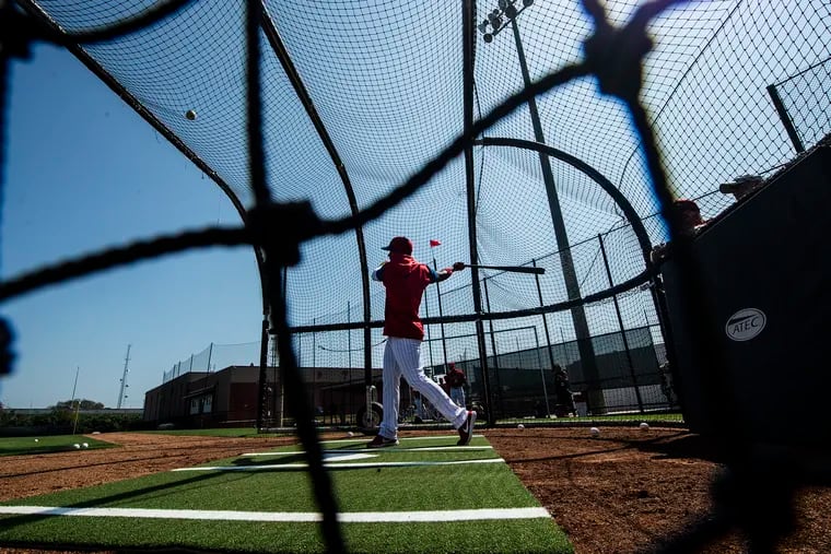 Inquirer photographer Jose Moreno captured Cesar Hernandez taking some cuts on Tuesday.