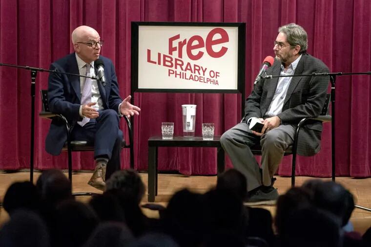 Michael Wolff (left) speaks onstage at the Free Library on Jan. 16, 2018, with Dick Polman (right), &quot;Writer in Residence&quot; at the University of Pennsylvania, and national political columnist at WHYY News, in the wake of the release of his book “Fire and Fury: Inside the Trump White House.”