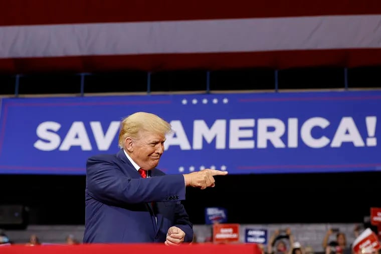 Former President Donald Trump points to supporters during a 2022 rally at the Mohegan Sun Arena at Casey Plaza in Wilkes-Barre, Pa.(Yong Kim/Staff Photographer)