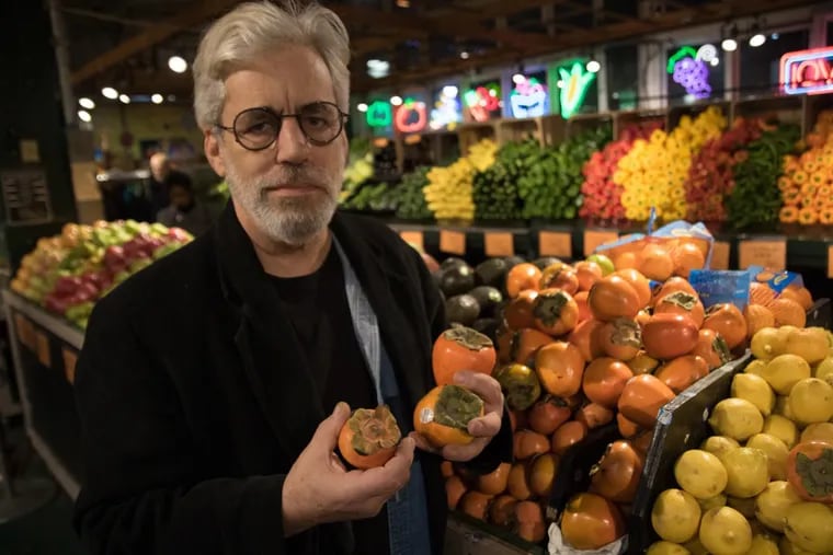 David Tanis browsing at Iovine’s Produce at Reading Terminal Market. His latest book, “Market Cooking,” suggests basing your cooking on what’s available.