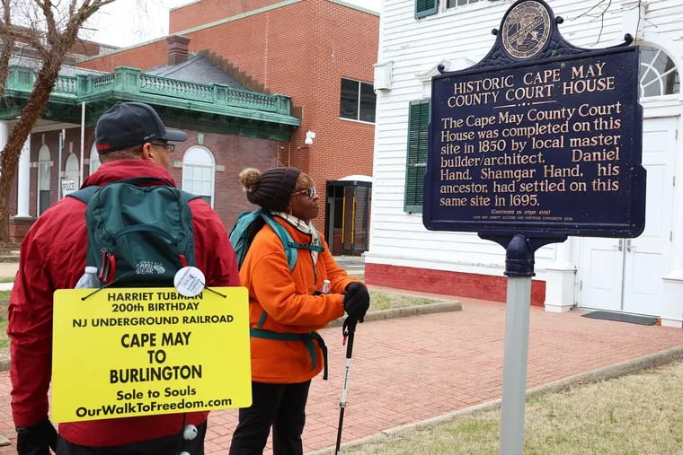 Ken Johnston, of Philadelphia, and Deborah Price, of Willingboro, N.J., begin their second part of their walk honoring Harriet Tubman in front of the Cape May County Court House on Sunday.