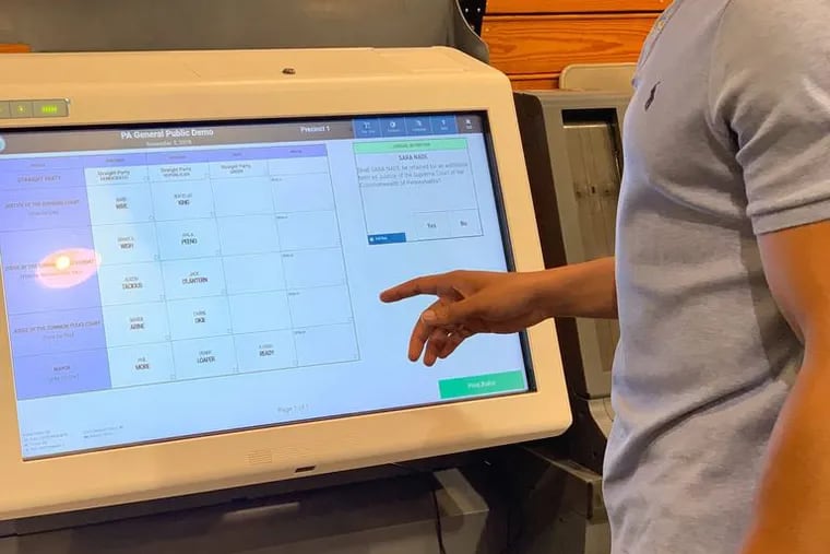 Aerion Abney of All Voting Is Local participates in a voting machine vendor demonstration held in Allegheny County June 2019.