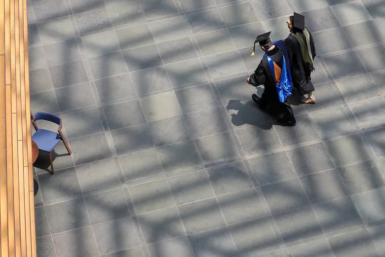 Participants in Thomas Jefferson University’s commencement make their way through the Kimmel Center last year.