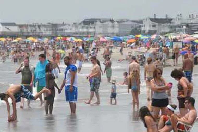 A recent Ocean City beach crowd.  More folks from the Gulf region are choosing to vacation at the New Jersey Shore because of the oil leak. ( April Saul / Staff Photographer)