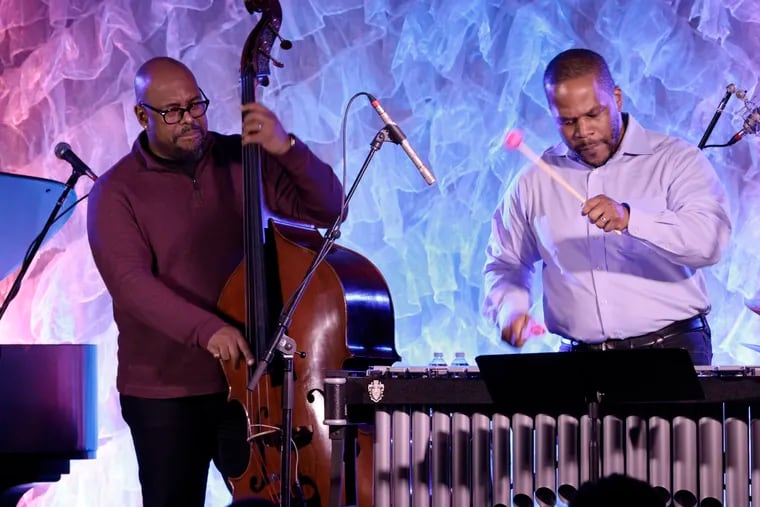 Bassist Christian McBride (left) and Warren Wolf on the vibraphone play during a Sunday, Feb. 27, concert at the Normandy Farms Hotel in Blue Bell, Pa.