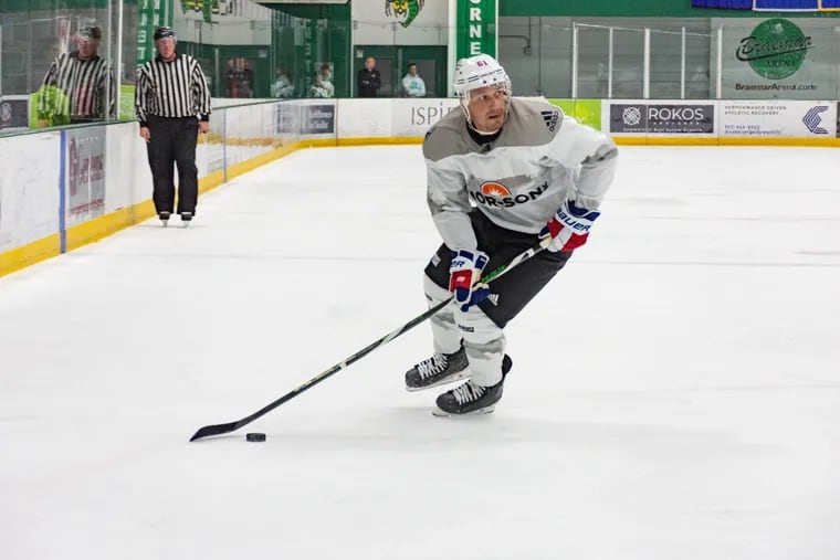 Philadelphia Flyers defenseman Justin Braun circles with the puck in a Da Beauty League game on Wednesday, July 20, 2022 in Minnesota. It was Braun's first time skating all offseason, but he still managed a goal and two assists.