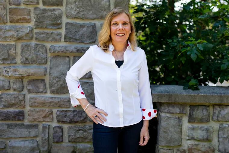 Nancy Connor, 53, of Erdenheim, Pa., founder and CEO of Smart Adaptive Clothing, poses for a portrait wearing one of her adaptive button down shirts.