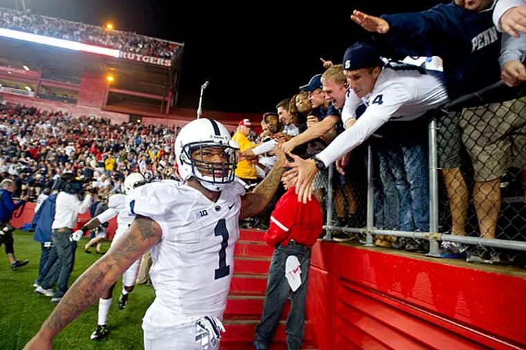 Penn State's Bill Belton high fives fans after the 13-10 win over Rutgers on Saturday, Sept. 13, 2014 game at High Point Solutions Stadium. Belton scored the Nittany Lions only touchdown. (AP Photo/Centre Daily Times, Abby Drey)