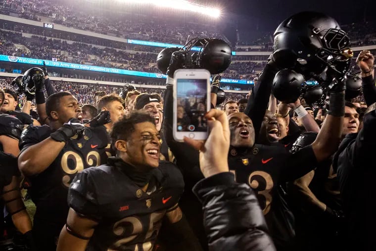 Army football team celebrates after beating Navy, 17-10, in the 119th Army-Navy football game at Lincoln Financial Field in Philadelphia on Saturday, Dec. 08, 2018. HEATHER KHALIFA / Staff Photographer
