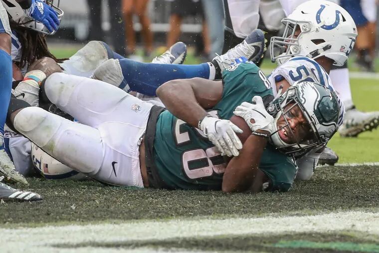 Eagle running back Wendell Smallwood crashes over the goal line in the fourth quarter to give the Ealges the lead 19-16 on Sunday , September 23, 2018. Eagles went on to win 20-16. MICHAEL BRYANT / Staff Photographer