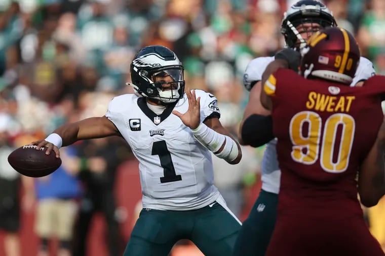 Eagles quarterback Jalen Hurts passed for 319 yards and four touchdowns against the Commanders.