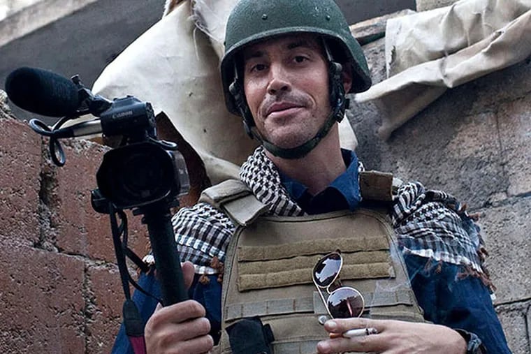 FILE - In this November 2012, file photo, posted on the website freejamesfoley.org, shows American journalist James Foley while covering the civil war in Aleppo, Syria. In a horrifying act of revenge for U.S. airstrikes in northern Iraq, militants with the Islamic State extremist group have beheaded Foley — and are threatening to kill another hostage, U.S. officials say. (AP Photo/freejamesfoley.org, Nicole Tung, File) NO SALES