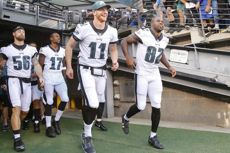 Eagles defensive end Chris Long, wide receiver Alshon Jeffery, quarterback Carson Wentz and wide receiver Torrey Smith leave the tunnel and enter the field before the Eagles played New York Jets in a preseason game on Thursday, August 31, 2017 in East Rutherford, NJ.