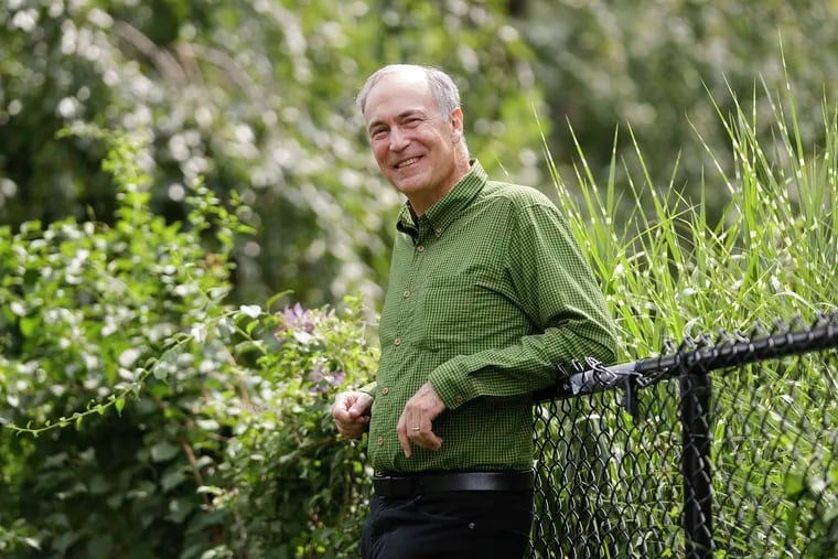 Wharton professor Eric Orts stands in a West Philadelphia park on Thursday after announcing he is running for U.S. Senate. Orts is running on a platform to address climate change.