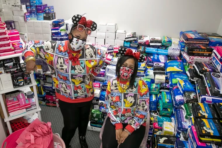 Lynette Medley, 51, left, and her daughter, Nya McGlone, 29, are pictured in a storage room at their menstrual hub, The SPOT Period, located at 4811 Germantown Ave., Suite 101 in Philadelphia.. The hub opens on Saturday.