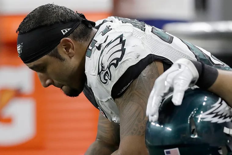 Eagles running back Ryan Mathews sits on the bench after fumbling the football.