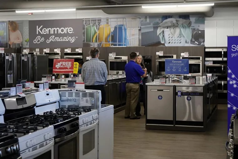 Customers browse appliances at a Sears.