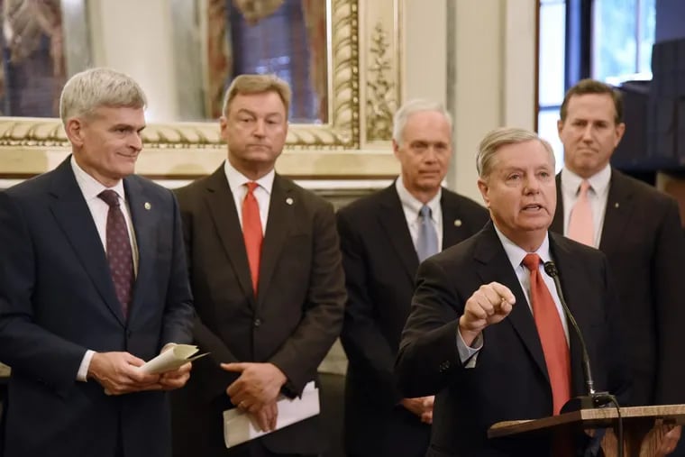 Sen. Lindsey Graham speaks during a news conference on health care on Sept. 13, backed by (from left) Republican Sens. Bill Cassidy, Dean Heller, and Ron Johnson, and former Sen. Rick Santorum.