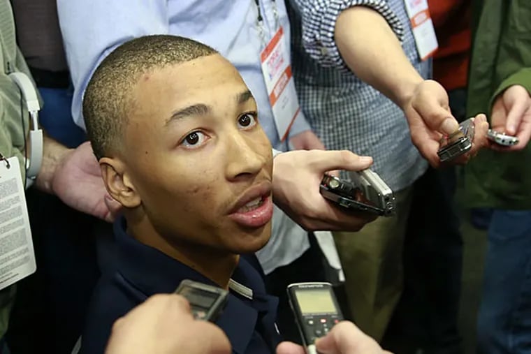 Dante Exum from Australia meets with reporters at the 2014 NBA basketball Draft Combine Thursday, May 15, 2014, in Chicago. Exum did not participate in his scheduled workout Thursday. (Charles Rex Arbogast/AP)