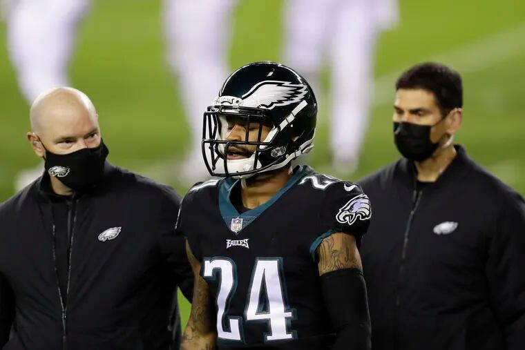 Eagles cornerback Darius Slay leaves the game with medical members after getting injured against the New Orleans Saints on Sunday.
