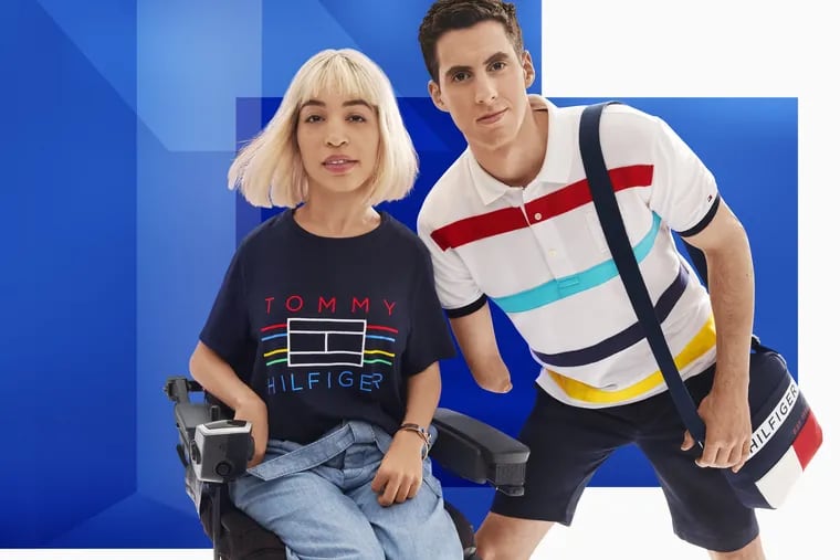 Julian W. Lucas, right, poses in a Tommy Hilfiger ad for the company's Adaptive line, which caters to people with disabilities. Lucas, 30, is a native of Holland, Bucks County.