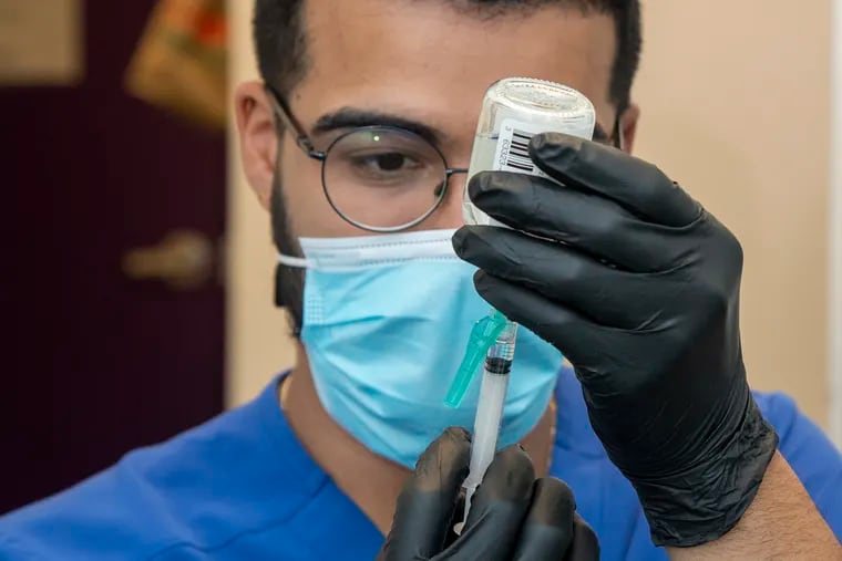 Dentist, Daniel Mariche-Poirot takes part on a vaccination training at the Philadelphia Fights Family Dentistry. Experts say vaccinations are key in curbing the spread of the Delta variant.