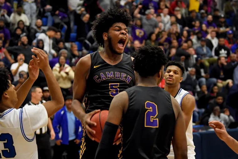 Camden's Taquan Woodley (No. 5) celebrates as the buzzer sounds in Camden's 63-54 victory over Wildwood Catholic at Neumann University Feb. 16. Woodley has committed to Penn State.