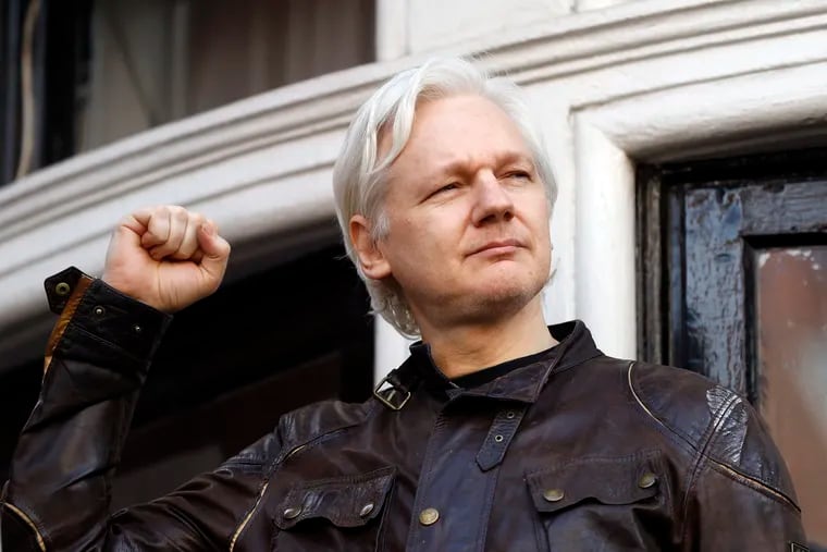 WikiLeaks founder Julian Assange greets supporters outside the Ecuadorian embassy in London in May 2017.