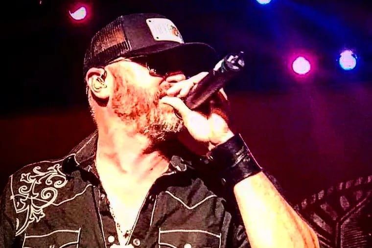 Brett Myers performs with his band "The Backwoods Rebels" at a concert in November.