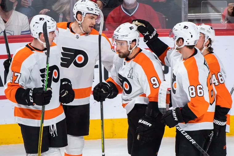 Philadelphia Flyers' Ivan Provorov (9) celebrates with teammates after scoring against the Montreal Canadiens during the first period of an NHL hockey game Thursday, April 21, 2022, in Montreal. (Graham Hughes/The Canadian Press via AP)