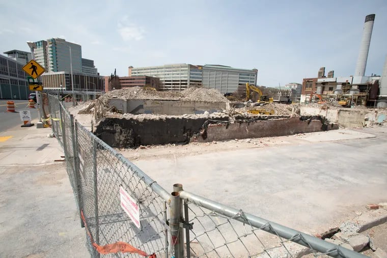 PIctured is the site of the demolished Patriot News building located at 812 Market Street, Harrisburg, Pa on Thursday April 11, 2019, with the red PSERS headquarters building in the background. The former newspaper and state printing buildings and neighboring lots on three blocks of Market Street were purchased by the taxpayer-backed school pension system, PSERS, whose executive director hoped to build a high-rise development and parking garages with state and university tenants, but the FBI is now investigating this and other PSERS activities. For the Inquirer/Kalim A. Bhatti