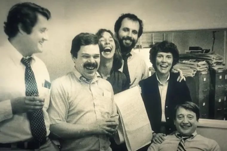 Larry Williams, second from left, celebrates The Inquirer's 1980 Pulitzer for its coverage of Three Mile Island. Others in the photo, from left: Maxwell E. P. King, Mary Walton, Steve Lovelady, Susan Q. Stranahan, and David R. Boldt.
