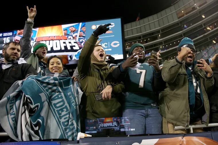 Eagles fans cheer as players leave the field after a first-round playoff game against the Chicago Bears at Soldier Field in Chicago on Sunday, Jan. 6, 2019. The Eagles won 16-15.
