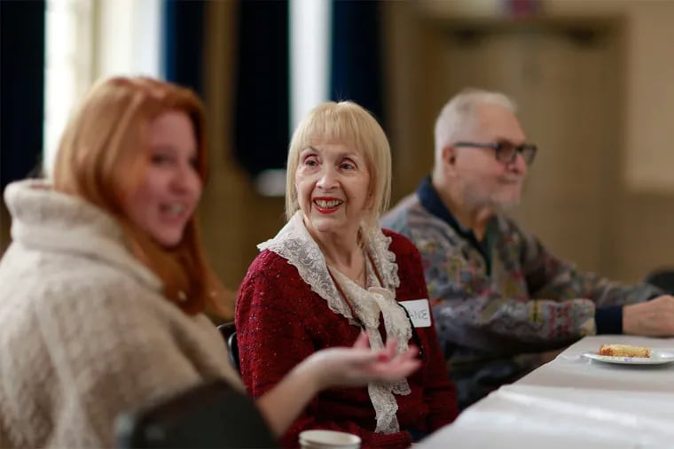 Genevieve Ilg (left) shares coffee with Diane and Paul Cagan of Society Hill at a &quot;memory caf&#0233;&quot; at Christ Church Neighborhood House in Old City. &quot;I love being with people and having fun,&quot; Paul Cagan said.