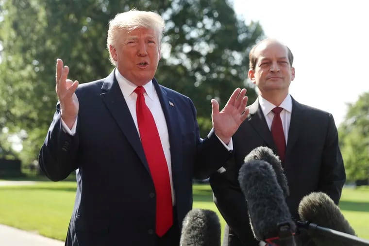 President Donald Trump speaks to members of the media with Secretary of Labor Alex Acosta on the South Lawn of the White House, Friday, July 12, 2019.