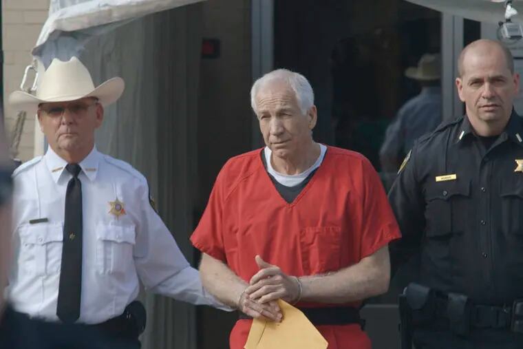 This photo provided by the Sundance Institute shows Jerry Sandusky, center, in the documentary film, "Happy Valley," by director Amir Bar-Lev. The Sundance Film Festival runs Jan. 16-26, 2014, in Park City, Utah.  (AP Photo/Sundance Institute, Asylum Entertainment)