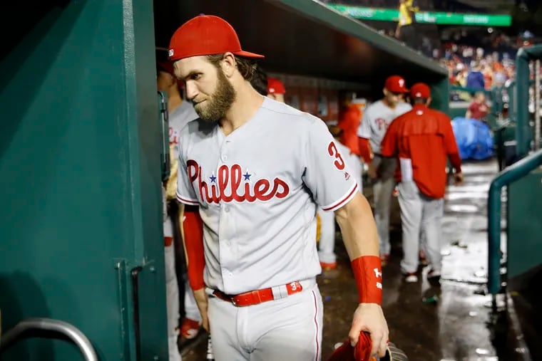 Philadelphia Phillies' Bryce Harper walks out of the dugout after the second baseball game of a doubleheader against the Washington Nationals, Wednesday, June 19, 2019, in Washington. Washington won 2-0. (AP Photo/Patrick Semansky)