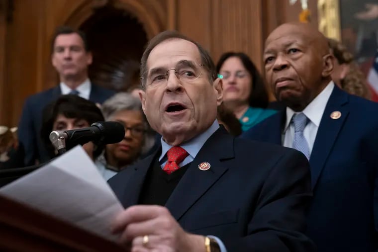 In this file photo from Friday, Jan. 4, 2019, Rep. Jerrold Nadler, D-N.Y., chairman of the House Judiciary Committee, joined at right by Rep. Elijah Cummings, D-Md., chairman of the House Committee on Oversight and Reform, speaks to House Democrats, now in the majority, during an event at the Capitol in Washington. Nadler says that he believes President Donald Trump obstructed justice and that House Democrats are requesting documents from scores of people from Trump's administration, family and business as part of the Russia probe. Nadler says the House Judiciary Committee on Monday is requesting documents from the Justice Department, Donald Trump Jr. and Trump Organization executive Alan Weisselberg.