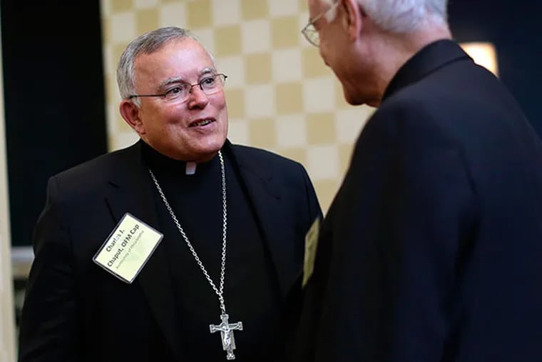 Philadelphia Archbishop Charles Chaput, left, chats with Brooklyn, N.Y., Auxiliary Bishop Raymond Chappetto at the United States Conference of Catholic Bishops' annual fall meeting in Baltimore, Tuesday, Nov. 12, 2013, their first national meeting since Pope Francis was elected. (AP Photo/Patrick Semansky)
