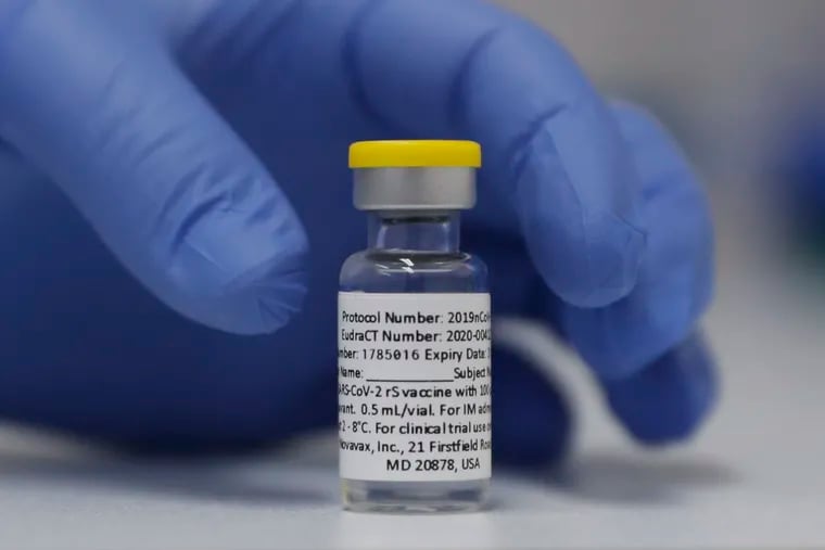 In this October 2020 photo, a vial of the Phase 3 Novavax coronavirus vaccine is seen ready for use in the trial at St. George's University hospital in London.
