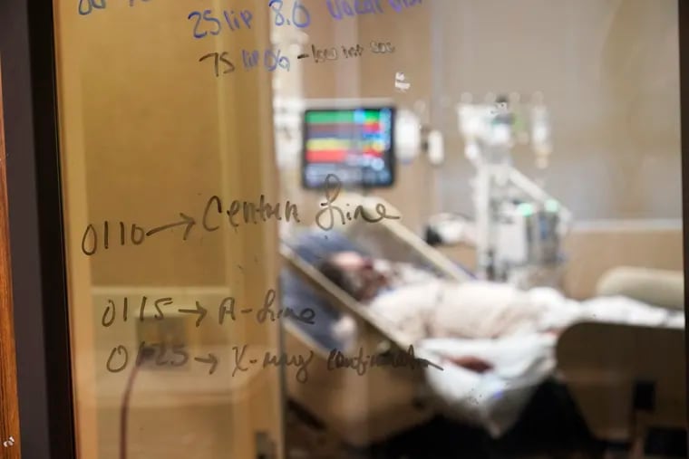 FILE - In this Wednesday, Aug. 18, 2021 file photo, Medical notations are written on a window of a COVID-19 patient's room in an intensive care unit at the Willis-Knighton Medical Center in Shreveport, La.  Louisiana hospitals already packed with patients from the latest coronavirus surge are now bracing for a powerful Category 4 hurricane, which is expected to crash ashore Sunday, Aug. 28, 2021.